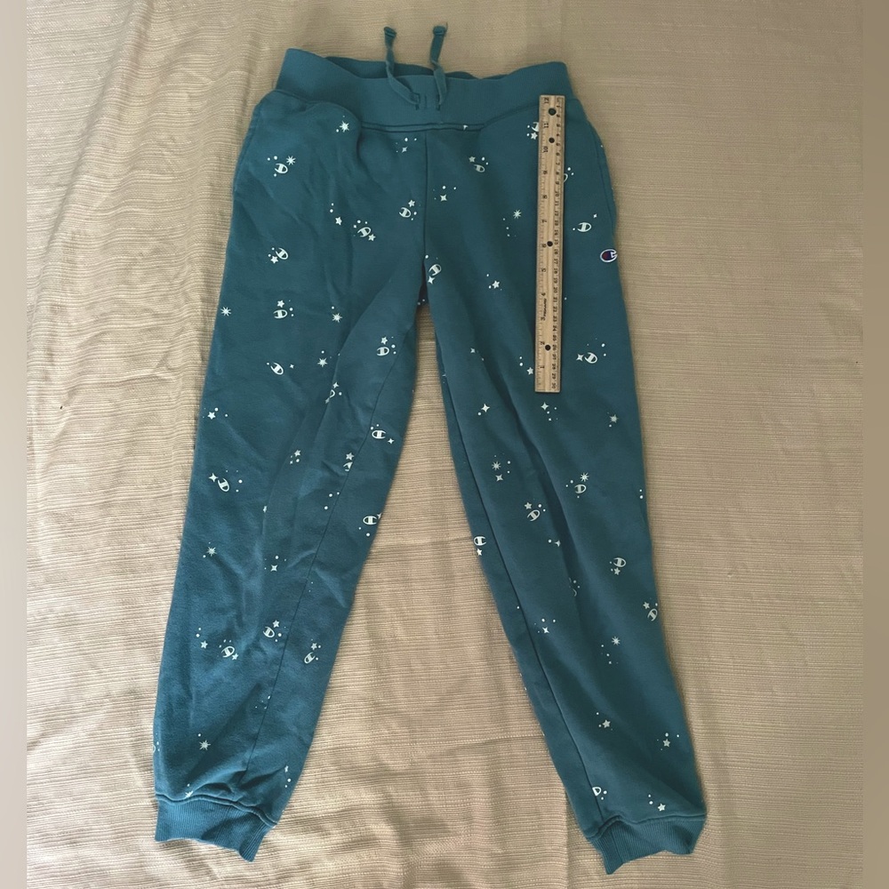 Kids Champion pants in a size LARGE! No damage. Compared to a 12in ruler!